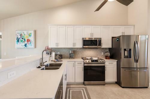 Waterfront Home With Golf Access & Heated Pool