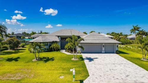 Waterfront Home With Golf Access & Heated Pool