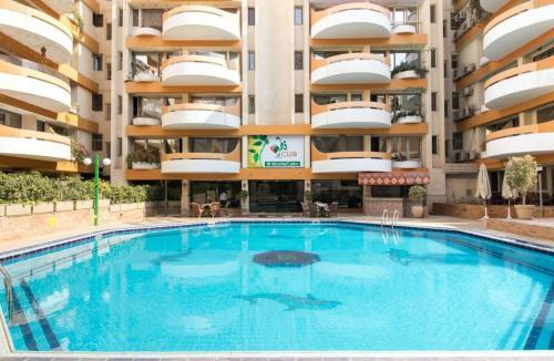 Apartment Overlooking A Pool In A Residential Condo