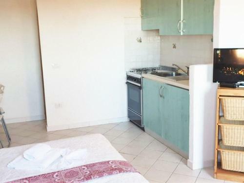 Lovely Holiday Home In Marinella With Shared Garden