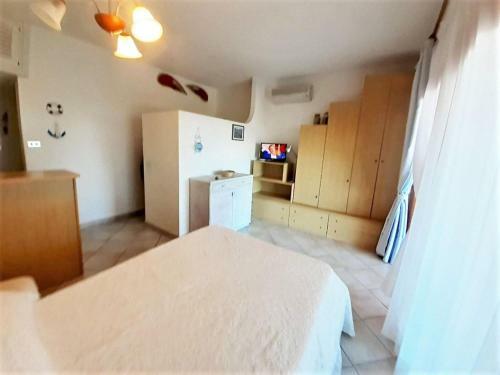 Alluring Holiday Home In Marinella With Shared Garden