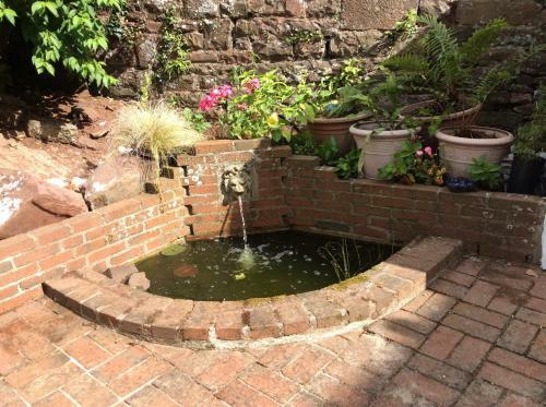 Apartamento Courtyard Cottage