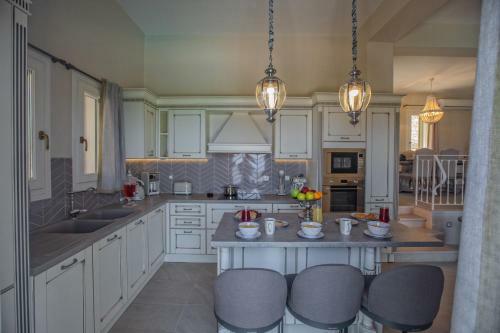 Luxury Villa Above Emblisi Beach , With Heated Pool !