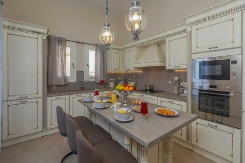 Luxury Villa Above Emblisi Beach , With Heated Pool !