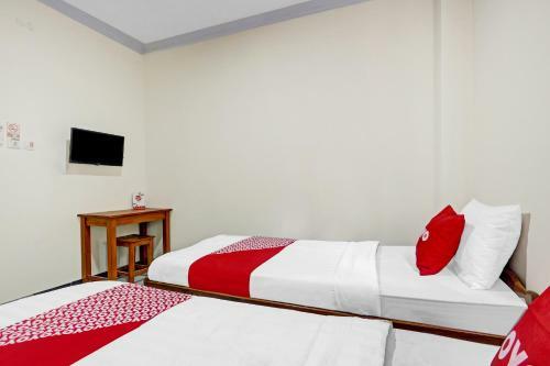 Hotel Oyo 90636 Happy Syariah