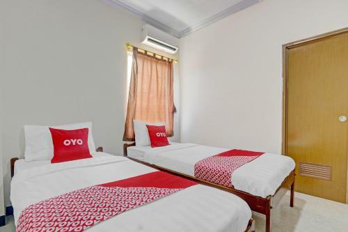 Hotel Oyo 90636 Happy Syariah