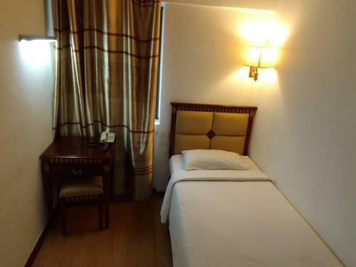 Oyo 90464 Borneo Suites Hotel
