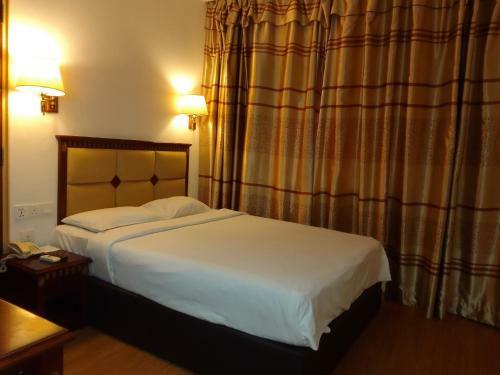 Oyo 90464 Borneo Suites Hotel