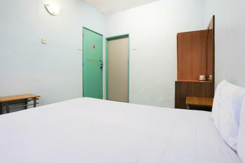 Spot On 89989 Wispering Hotel