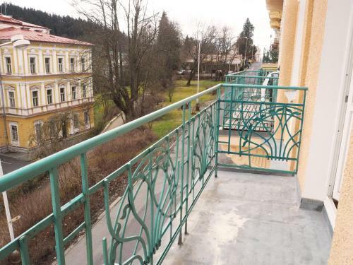2 Balconies Above Colonnade Apartment
