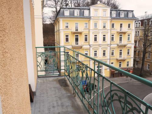 2 Balconies Above Colonnade Apartment