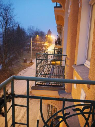 2 Balconies Above Colonnade Apartment