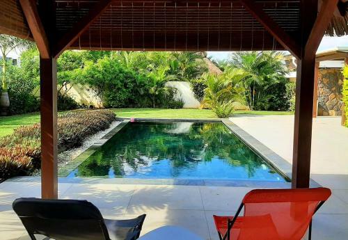 Pool Villa Surrounded By Tropical Greenery