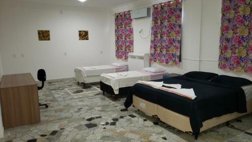 Hostal Su�tes Enseada