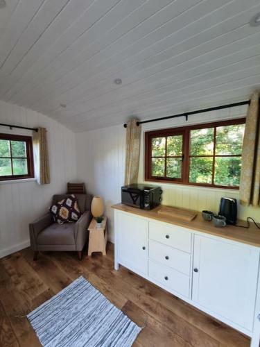 Shepherds Hut Surrounded By Fields And The Jurassic Coast