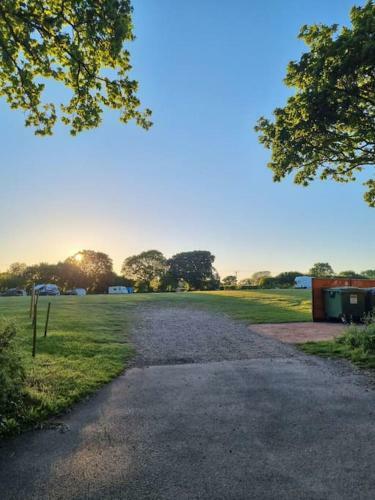 Shepherds Hut Surrounded By Fields And The Jurassic Coast
