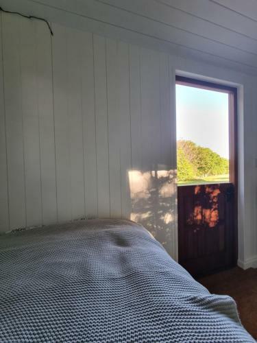 Shepherds Hut Surrounded By Fields And The Jurassic Coast