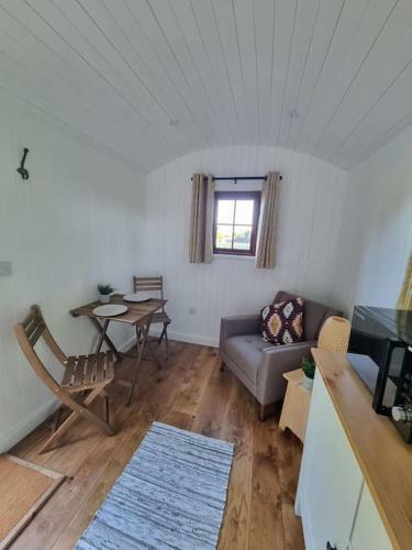 Shepherds Hut Surrounded By Fields And The Jurassic Coast