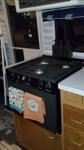 Rv With 3 Beds Plus Set Up Tent With One Bed Close To Everything