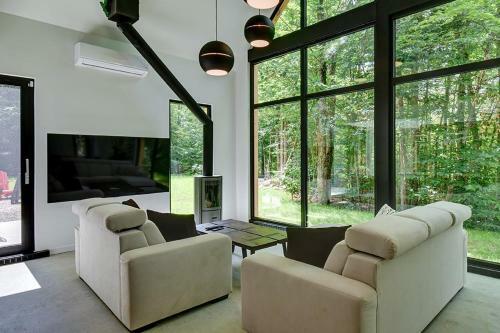 Large Windowed Chalet Surrounded By Nature