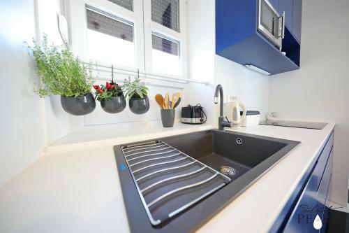 Apartamentos Three Pearls Deluxe Rooms
