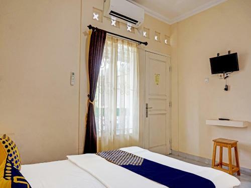 Hotel Spot On 91461 Saungawi Stay Syariah