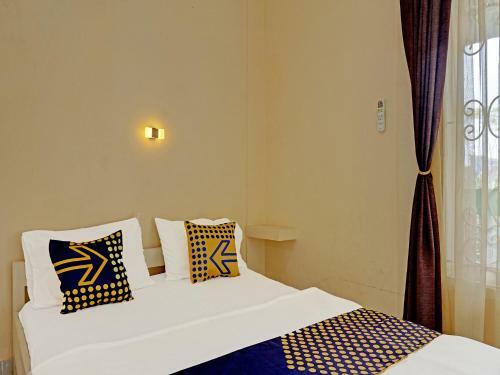 Hotel Spot On 91461 Saungawi Stay Syariah