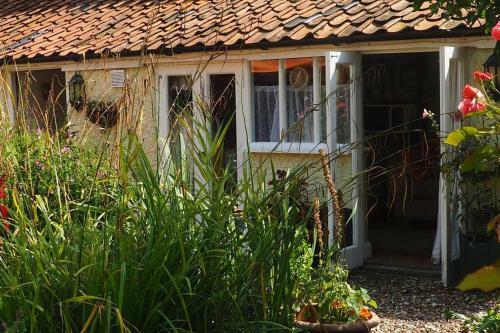 Apartamento West Cottage Cosy Bedsit Stay.