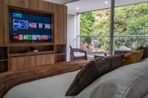 Apartamento H602 - Cozy Garden View, Fast Wifi & Rooftop Pool
