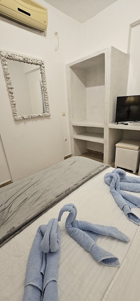 Santorini Studios Pleasure By The Sea