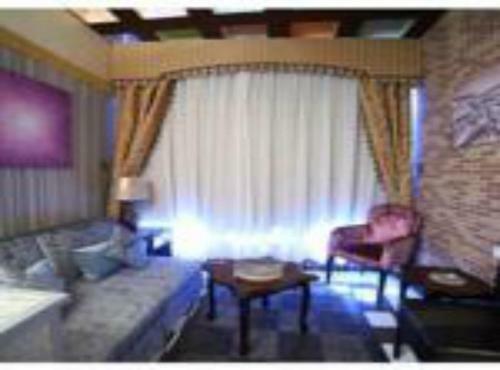 Apartamento Roomi Suites Hotel
