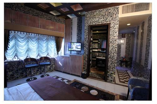 Apartamento Roomi Suites Hotel