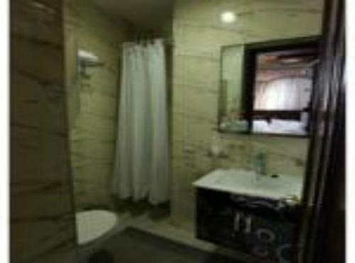 Apartamento Roomi Suites Hotel