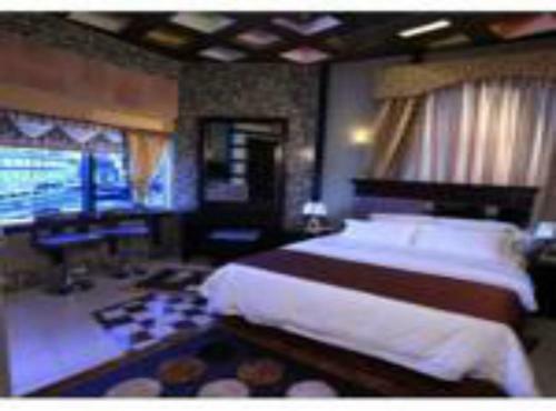 Apartamento Roomi Suites Hotel