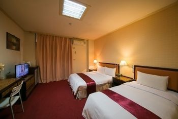Apartamento Jiuning Business Hotel