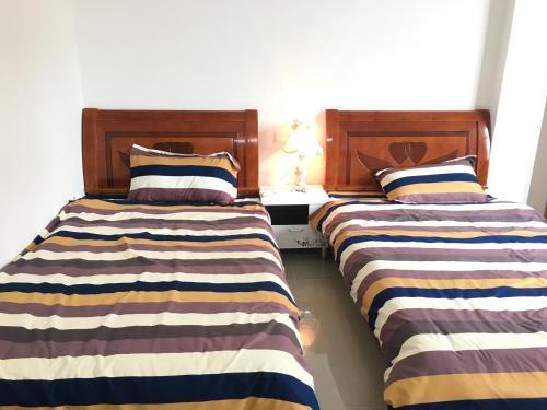 Apartamento Shuangyuewan Happy Inn