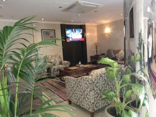 Apartamento Al Ezzah Palace Hotel Suites