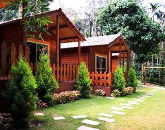 Oyo 26892 Coorg Amodhini Wood Cottage Suits